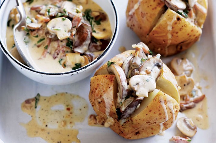 Baked potatoes with mushrooms and bacon sauce